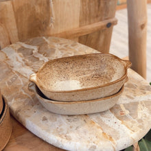 Load image into Gallery viewer, Stack of ceramic bowls on a marble surface with a rustic wooden chair in the background.

