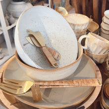 Load image into Gallery viewer, Dishes and kitchenware on a wooden table with shelves in the background
