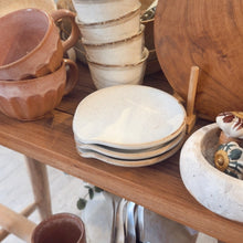 Load image into Gallery viewer, Collection of ceramic dishes and bowls on a wooden shelf.
